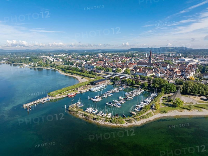 Aerial view of the town of Radolfzell on Lake Constance with the Wäschbruckhafen, harbour pier and concert sail, on the horizon the Hegauberge, district of Konstanz, Baden-Württemberg, Germany