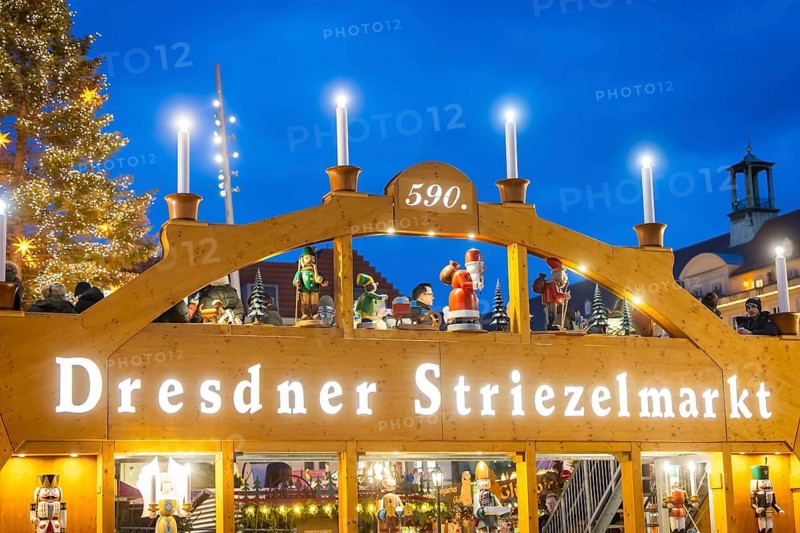 The Dresden Striezelmarkt is a Christmas market in Dresden. It has been held in Advent since 1434, usually on the Altmarkt square, and attracts an average of around two million visitors every year. It is the oldest certified Christmas market in Germany. Walk-in candle arch. Dresden, Saxony, Germany