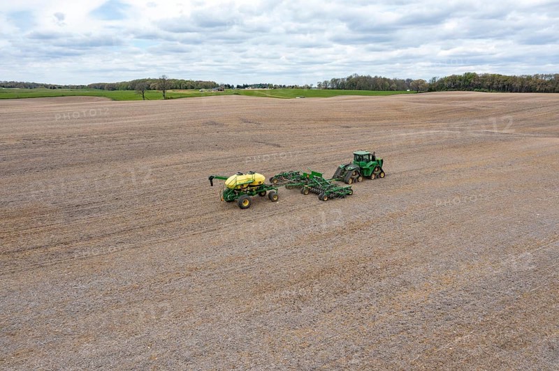Grass Lake, Michigan - A farmer applies liquid fertilizer to a farm field in early spring. The war in Iran and the blockage of the Strait of Hormuz have dramatically raised the price of fertilizer and the cost of diesel fuel used in farm equipment