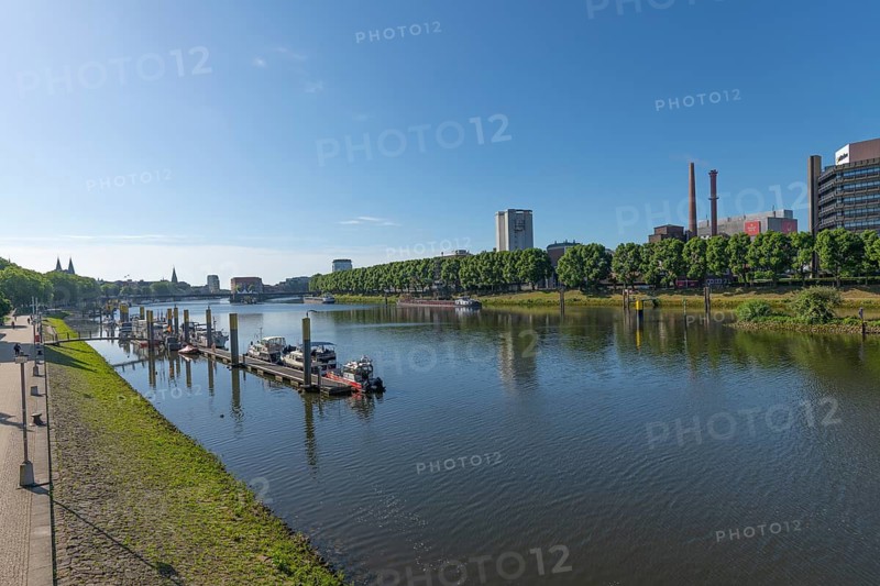 Port of Motorsportboot Bremen e.V. on the Weser, Hanseatic City of Bremen, city skyline, Weser promenade for cyclists and pedestrians, shore, pier with building, water reflection, motor boats, sports, leisure, fun, tree-lined avenue, Beck's beer, silos, blue sky, Germany