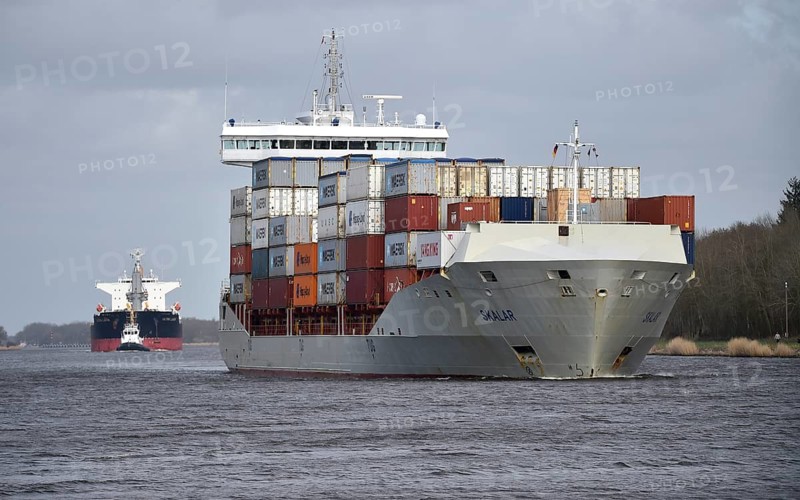 Container ship SKALAR sails in front of freighter ULTRA LANIN in the Kiel Canal, NOK, Kiel Canal, Kiel Canal, Schleswig-Holstein, Germany