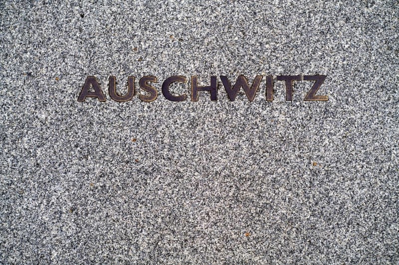 Floor plate with the inscription German concentration camp, death camp AUSCHWITZ in front of the main entrance, Broadcasting House, BBC, British Broadcasting Corporation, City of London, Langham Place, London, England, Great Britain