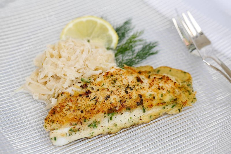 Swabian cuisine, fillet of Lake Constance whitefish with herbs and creamed cabbage, sauerkraut, fish dish, freshwater fish, served on a plate, dill, lemon slice, fish cutlery, typical Swabian cuisine, traditional cuisine reinterpreted, food photography, studio, Germany