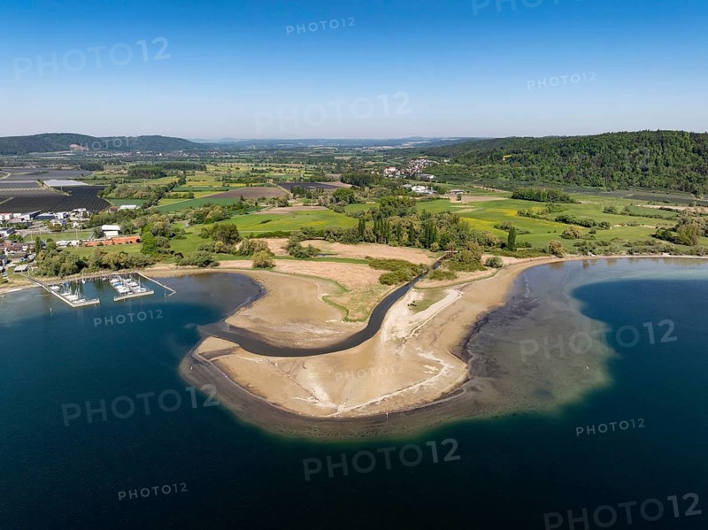 Aerial view of the mouth of the Stockacher Aach at low water, which flows into Lake Überlingen. The sedimentation of the suspended matter and sediment carried by the tributary is gradually silting up the shore zone near Bodman-Ludwigshafen. Lake Constance, district of Constance, Baden-Württemberg, Germany