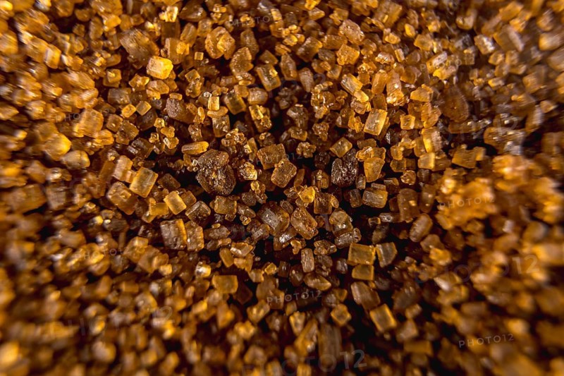 Detail of texture of beautiful brown sugar grains, macro photography
