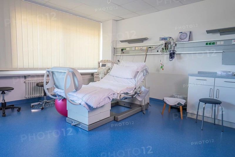 A birthing room with blue floors and a modern hospital bed, delivery room of the new gyn and obstetrics ward of the Klinikverbund Südwest, Nagold, Calw district, Germany