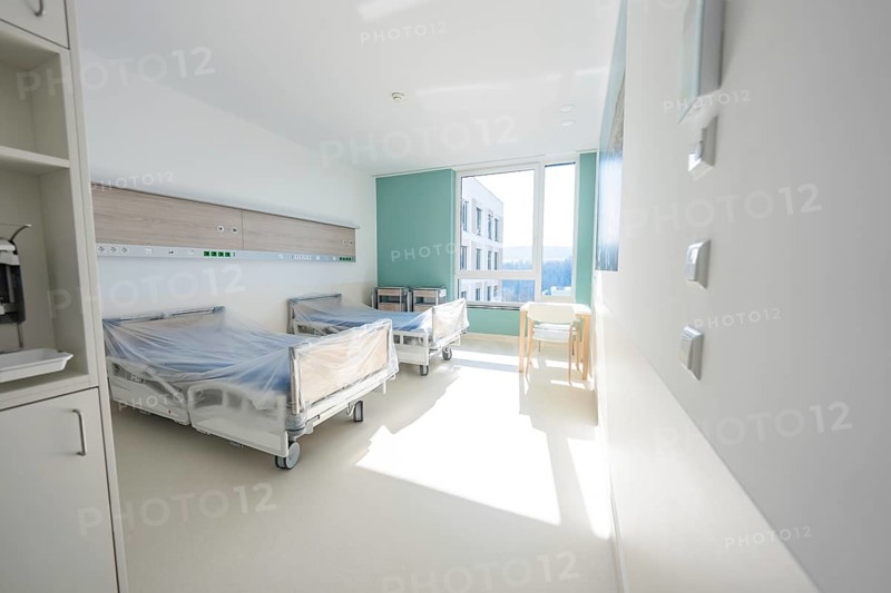 Bright hospital room with beds and large window in modern style, patient room cash desk in the new Calw hospital, Black Forest, Germany