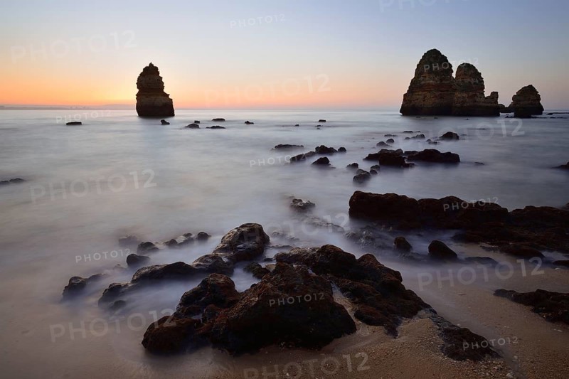 Beach and rock formations at dawn, Praia do Camilo, Lagos, Algarve, Portugal