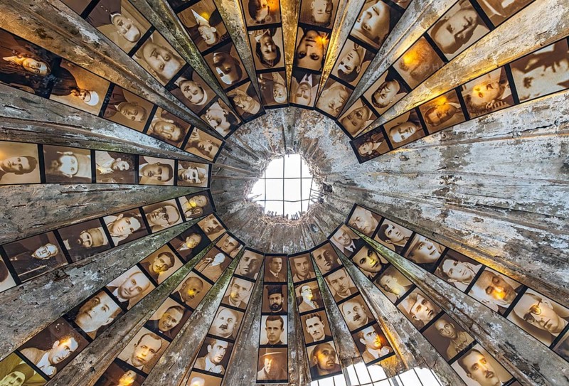 An upward look inside the concrete bunker dome lined with portraits of victims of the communist regime, Bunk'Art 2 museum, Tirana, Albania