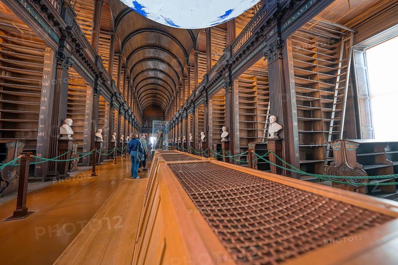 Wide library with vaulted ceiling and empty bookshelves, detailed view, Trinity Collage, Dublin, Ireland