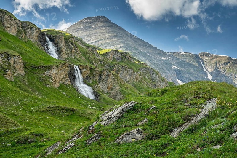 Waterfall and mountain meadows at Nassfeld, Heiligenblut, Carinthia, Austria