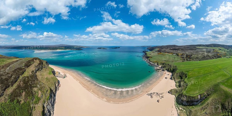 Aerial panorama photo of bay with golden sand beach and turquoise water at the scottish atlantic coast near Coldbackie, Northern Scotland, UK
