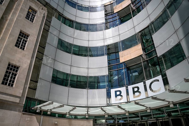 Entrance area of the BBC Broadcasting House with the distinctive curved glass façade and the BBC logo, Portland Place, City of Westminster, London, England, Great Britain, Great Britain
