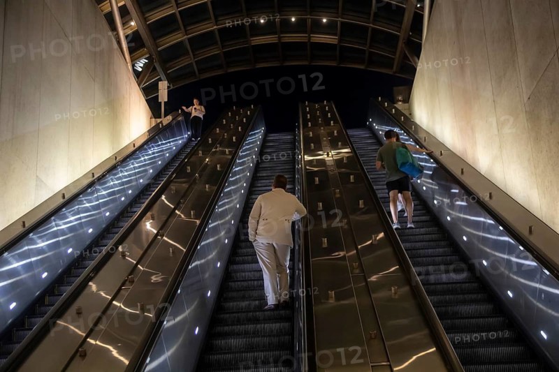 Washington, DC - Passengers ride escalators in and out of the Eastern Market station on the Washington Metro subway system