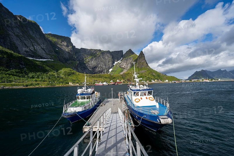 Jetty with boats, fjord landscape with mountains, Reinefjord, Reine, Lofoten, Norway