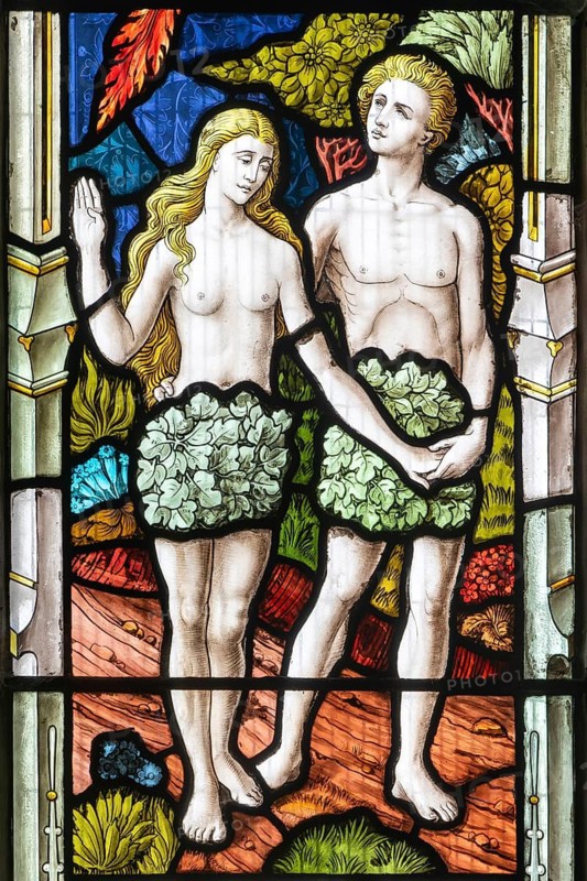 Stained glass window Adam and Eve Garden of Eden c 1883, St Andrew's church, Ashburton, Devon, England, UK