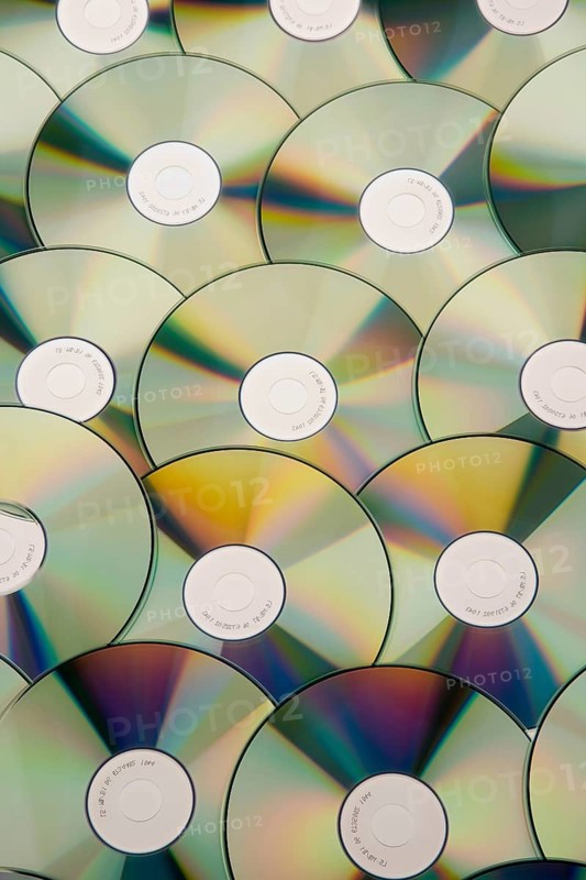 A table full of CD-ROM and DVD, pirated copy, studio recording, Austria