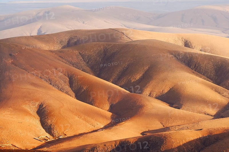 View of the barren and eroded landscape from the Mirador Morro Velosa viewpoint, Fuerteventura, Canary Islands, Spain