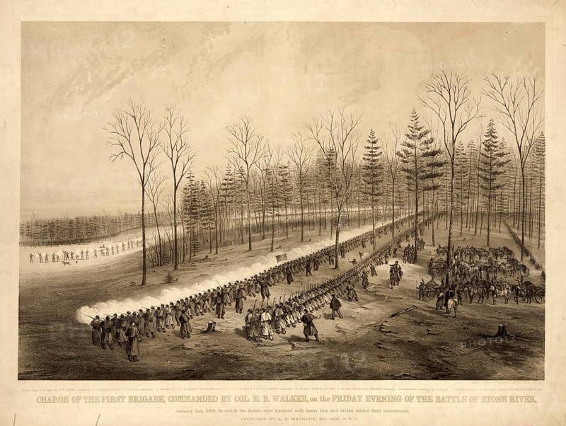 Lithograph of the attack of the 1st Brigade under Colonel M. B. Walker during the Battle of Stones River on January 2, 1863 in Tennessee. Union troops march in formation through a wintery forest landscape, while artillery and troop movements can be seen in the background, authentic, digitally restored reproduction in high resolution from a 19th-century original, exact date of depiction unknown, American history, historical