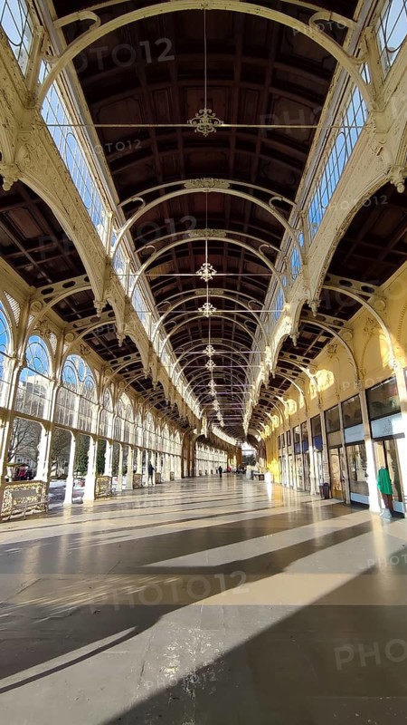 Long, light-filled corridor with decorative arches and large windows, Maxim Gorky Kollonade, Marianske Lazne main colonade, Marianske Lazne, Czech Republic