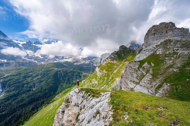 Mountaineers in front of picturesque mountain scenery at the summit of Tanzbödeli, mountain landscape with Breithorn and Tschingelhorn peaks, Bernese Alps, Bernese Oberland, Switzerland
