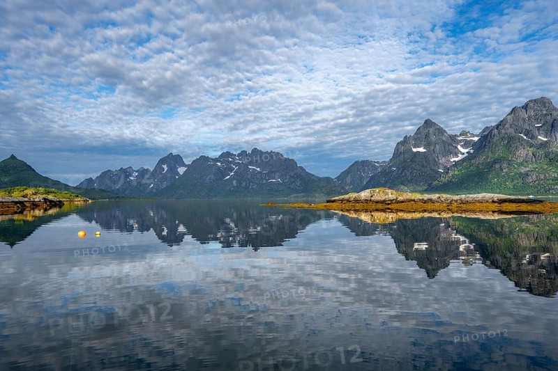 Picturesque fjord landscape at Raftsund fjord, mountains reflected in water, Vesterålen, Norway