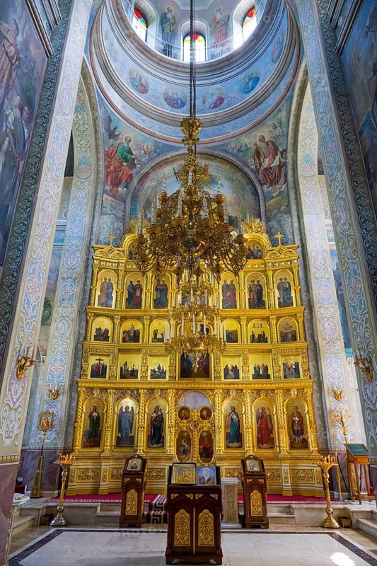 Beautiful interior of an Orthodox church with golden iconostasis and frescoes, Capriana monastery, Capriana, Stra?eni district, Straseni, Republic of Moldova, Moldova