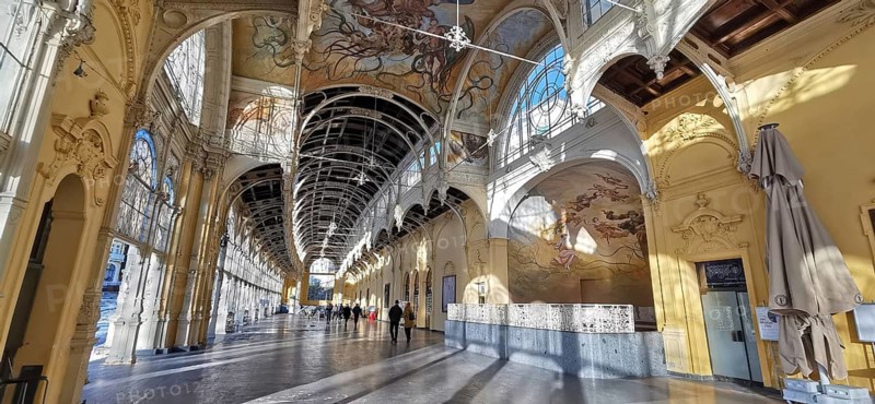 Historic arcades with ornate frescoes on the ceiling in yellow and warm tones, Marianske Lazne, Maxim Gorky Kollonade, Marianske Lazne main collonade, Marienbad, Czech Republic