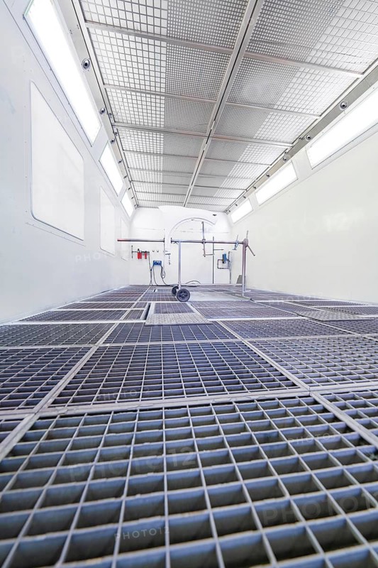 Industrial painting booth with mesh floor and equipment in bright surroundings, Painter, Calw, Germany