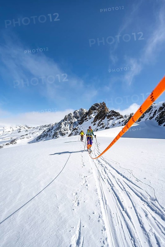 Ski tourer with rope, rope team on the Vadret da Porchabella glacier on the ascent to the summit of Piz Kesch, mountain landscape in winter, alpine tour, ski tour Bündner Haute Route, Albula Alps, Rhaetian Alps, Grisons, Eastern Switzerland, Switzerland