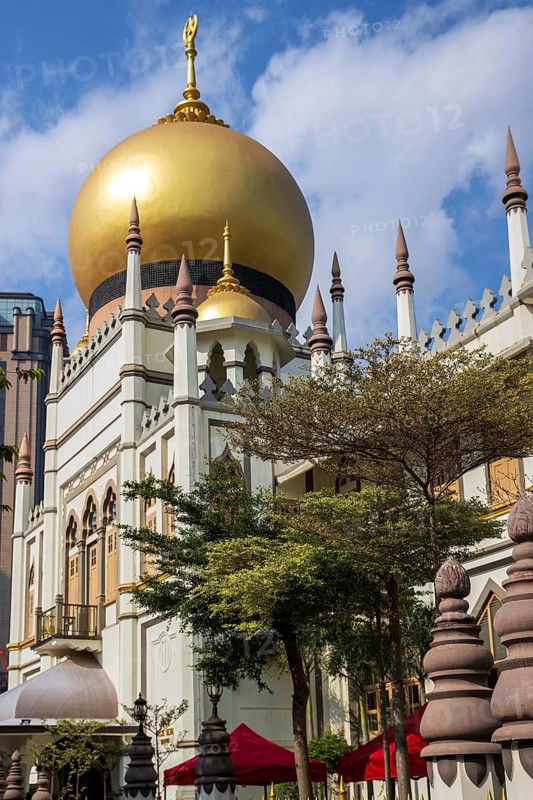 Golden dome and minarets of Sultan Mosque rebuilt in 1932 to designs by Denis Santry rises above Kampong Glam, Singapore