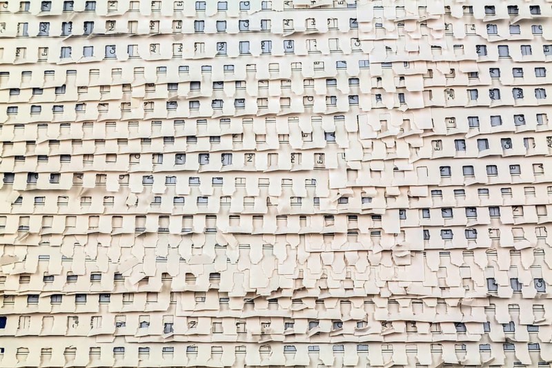 Close-up of overlapping ripped and torn out white perforated pages background from spiral bound telephone and address book, Studio Composition, Quebec, Canada