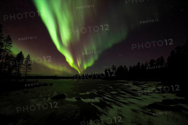 Northern Lights (Aurora borealis) over a frozen lake, Norrbotten, Lapland, Sweden, October 2022