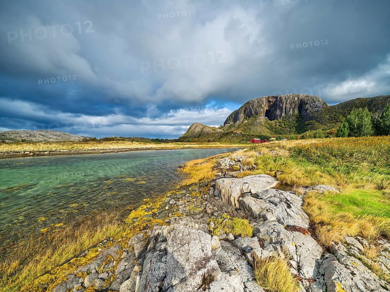 A peaceful landscape with a fjord surrounded by mountains under a dramatic sky, sea, Torghatten, mountain, Brønnøysund, Helgelandskysten, Norway