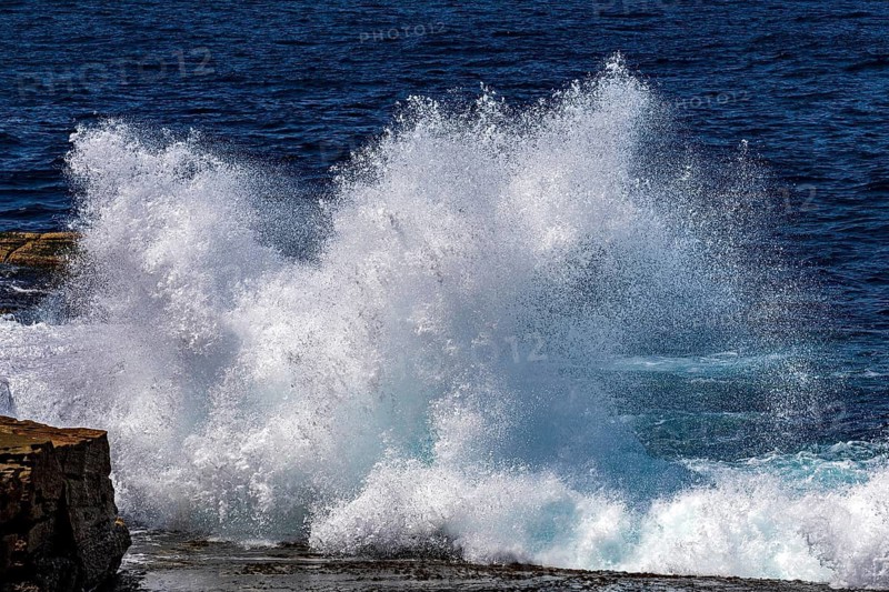 Waves crash into rocks on the coastline at Maroubra, Sydney, New South Wales, Australia