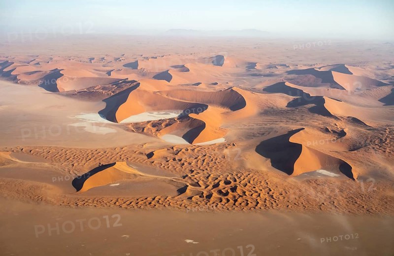 Aerial view of salt pans and red sand dunes of the Namib Desert, Namib Naukluft Park, Namibia