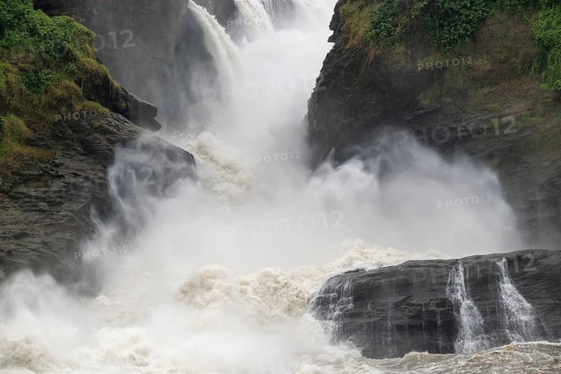 Masses of water tumble down over rocks, Murchison Falls, White Nile, Murchison Falls National Park, Uganda, East Africa