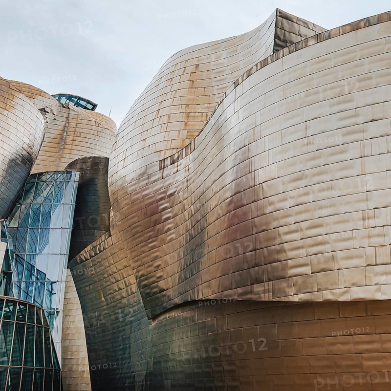 Exterior view of the Guggenheim Museum with titanium plates and glass elements in Bilbao, Spain