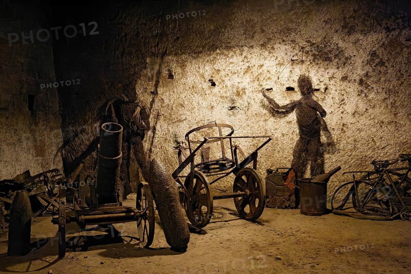 Second World War cannon and scrap on display in the Borbonica Gallery, Bourbon Tunnel, Naples Underground, Province of Campania, Italy
