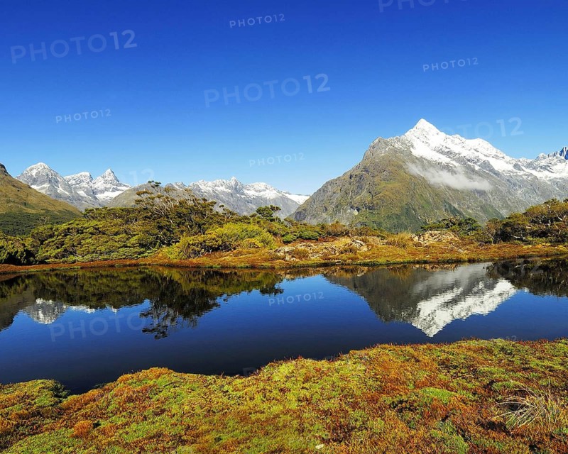 Key Summit with reflection of Mt. Christina, Fjordland National Park, World Heritage Site South West New Zealand, West Coast, South Island of New ZealandKey Summit with reflection of Mt. Christina, Fjordland National Park, World Heritage Site South West New Zealand, West Coast, South Island of New Zealand, February 2007, New Zealand