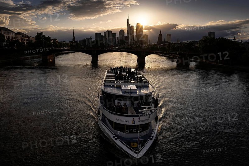 The sun sets behind Frankfurt's banking skyline, Frankfurt am Main, Hesse, Germany