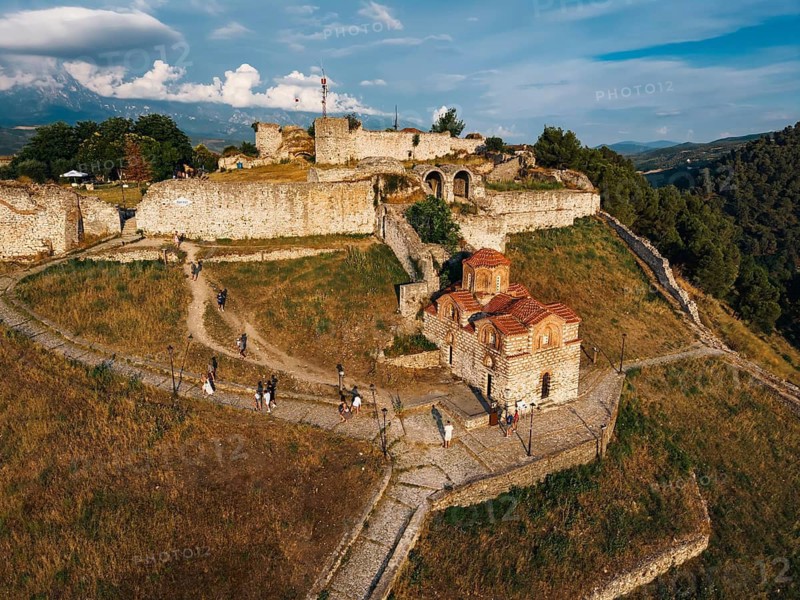 BERAT, ALBANIA - JULY 2, 2026: Aerial view of the ancient stone walls of Berat Castle enclosing Holy Trinity Church