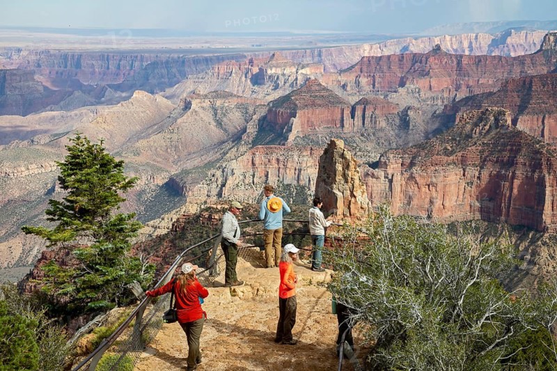 Grand Canyon National Park, Arizona - Visitors view the Grand Canyon at Point Imperial on the North Rim, a year after the Dragon Bravo fire. Some North Rim roads, trails, and visitor services are open, while others are still being repaired from their fire damage