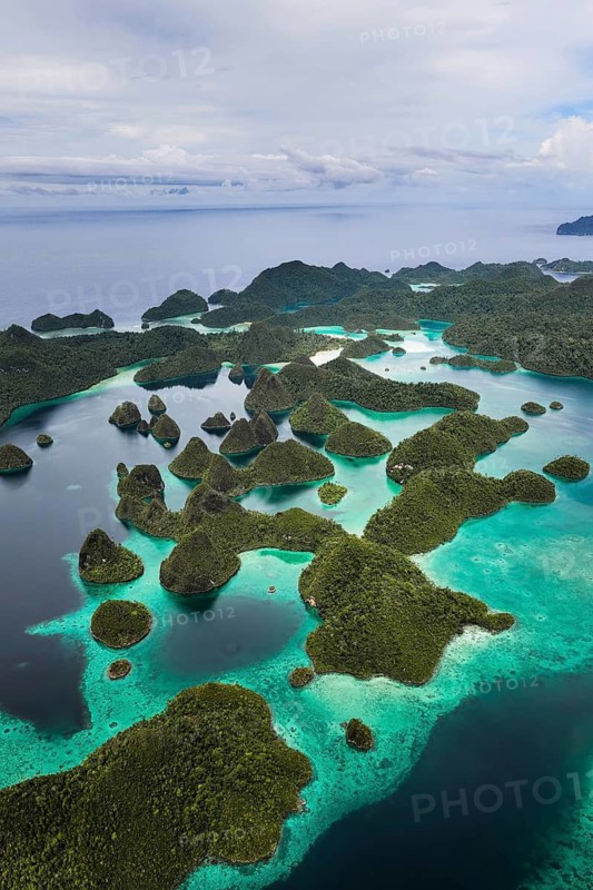 Aerial view of tropical islands and turquoise lagoons, Wayag Archipelagio, West Papua, Indonesia