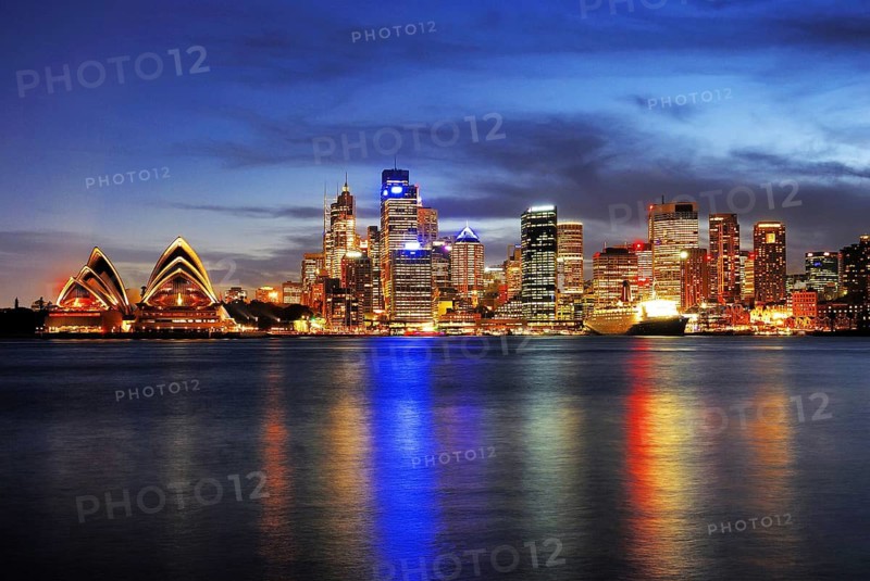 Sydney skyline with Sydney Opera and luxury liner Queen Mary 2 during the blue hour, Circular Quay, Sydney Cove, Sydney, New South Wales, Australia Sydney, New South Wales, Australia