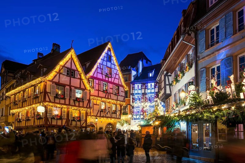 Colourfully illuminated and Christmassy decorated half-timbered houses, old town, blue hour, Colmar, Haut-Rhin department, Alsace, France