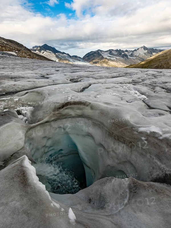 Glacier mill, glaciated mountains behind, Venedigerkees, Venice Group, Hohe Tauern National Park, Province of Salzburg, Austria
