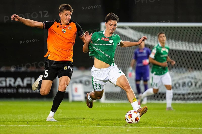 GLOGOW, POLAND - AUGUST 21, 2026: Football match polish Betclic 1. first league between Chrobry Glogow - Warta Poznan. In action Radoslaw Bak (L) Patryk Kusztal (R)