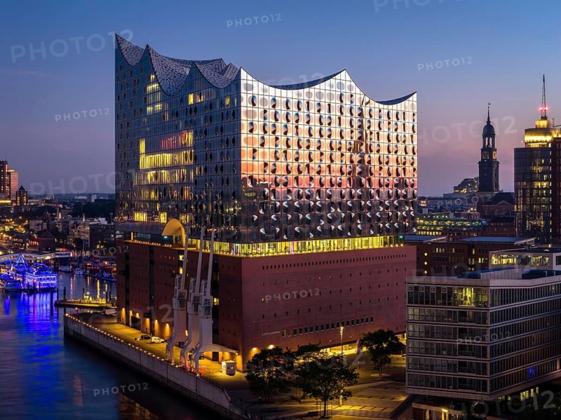 Aerial view of the sunrise on the Elbe with Elbe Philharmonic Hall and St Michael's Church (Michel), Hamburg, Germany