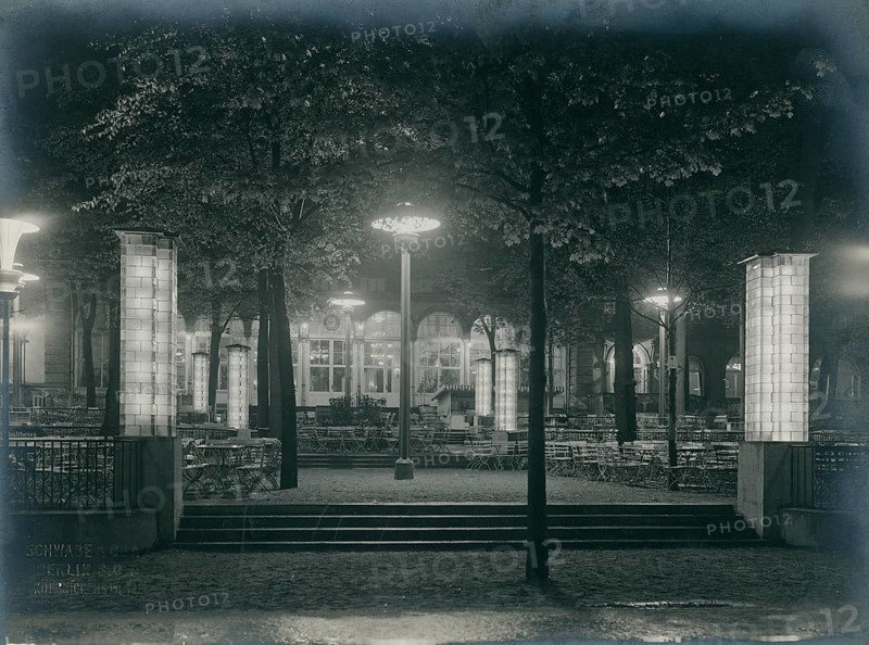 Berlin, zoological garden, garden restaurant, modern lighting, destroyed during war, garden at night, illuminated by mystical lanterns with a calming yet mysterious atmosphere, Schwabe Co., 1928